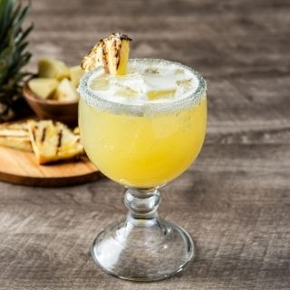 Pineapple Margarita: Premium pineapple margarita with 100% Blue Agave Jose Cuervo Tradicional Silver Tequila, triple sec, fresh lime juice, and pineapple juice.