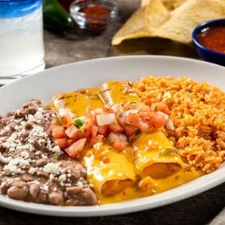 Cheesy Queso Enchiladas: Two cheese enchiladas topped with signature queso and pico de gallo. Served with Mexican rice and choice of beans.