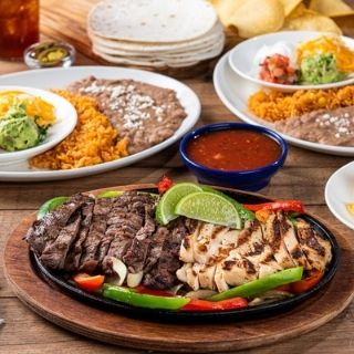 Classic Fajitas for Two: Choose any two Classic Fajita styles plus double the sides including hand-pressed flour tortillas, pico de gallo, cheese, Mexican rice and choice of beans.