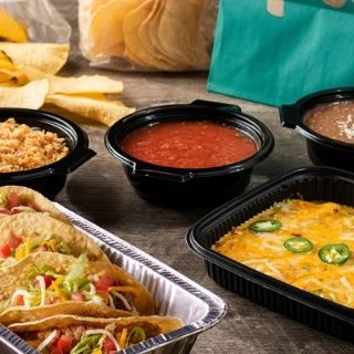 Taco & Enchilada Family Meal: Five soft or crispy seasoned ground beef or chicken tinga tacos topped with lettuce, mixed cheese and tomato, and five seasoned ground beef, chicken tinga or cheese & onion enchiladas. Served with Mexican rice, choice of beans and chips & salsa.