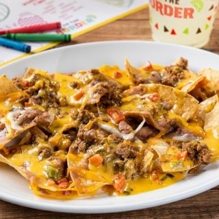 Big Kid Nachos: Big nacho chips topped with refried beans, seasoned ground beef, mixed cheese and our signature queso.