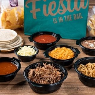 Primo BYO Taco Kit: Brisket or mesquite-grilled chicken, 10 flour tortillas, onion strings, shredded cheese and sauce. Served with Mexican rice, choice of beans, a bowl of signature queso and our famous chips & salsa.
