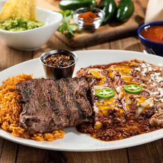 Ranchiladas with Jalepenos: A 9 oz. mesquite-grilled steak served with roasted red-chile tomatillo salsa, plus two hand-rolled cheese enchiladas smothered in chile con carne.
