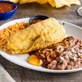 New Mexico: Cheese chile relleno and carnitas enchilada, topped with salsa verde. Served with Mexican rice and choice of beans.