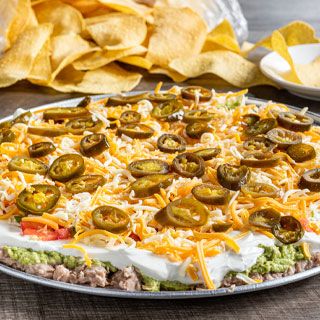 5-Layer Dip: Served chilled with layers of refried beans, guacamole, sour cream, pico de gallo, mixed cheese and pickled jalapeños. Served with tortilla crisps.