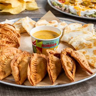 CYO Platter: 24 Pieces. Pick any two, three or four: empanadas, mini chimis, mini burritos, mini quesadillas, chicken tenders with ranch dressing or chicken flautas. Served with our Signature Queso.