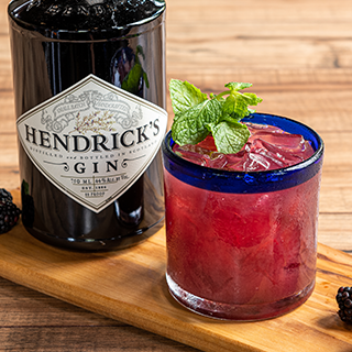 Blackberry Smash: Hendrick's-a most unusual premium gin, shaken with blackberry and lime, garnished with fresh mint leaves.