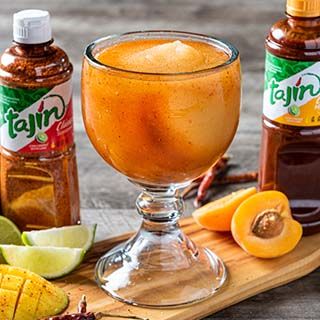 Mangonada Golden Golden Sweet mango frozen margarita with subtle saltiness of chamoy and Spicy Tajin Clasico Seasoning make this a traditional Mexican frozen favorite